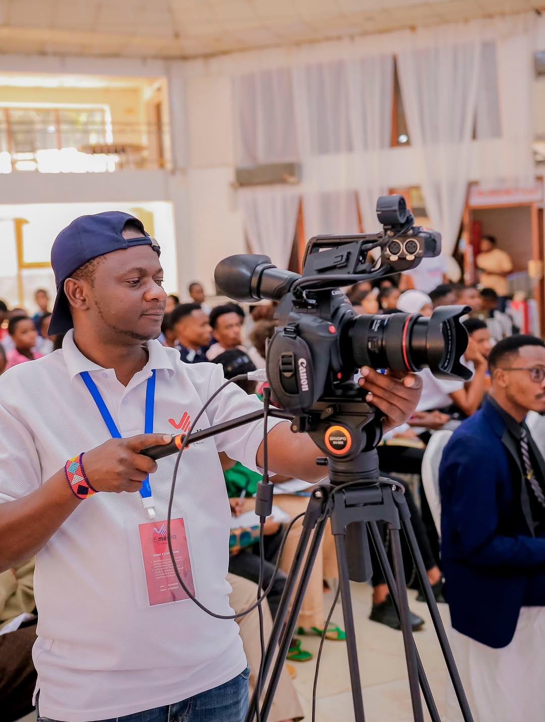 B5 Media camera operator filming a professional event